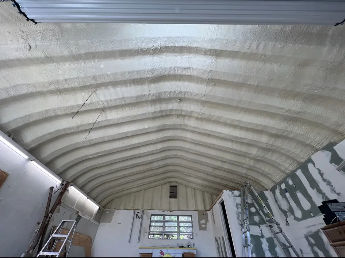 Spray polyurethane foam applied to the underside of a metal roof deck in Woodmoor